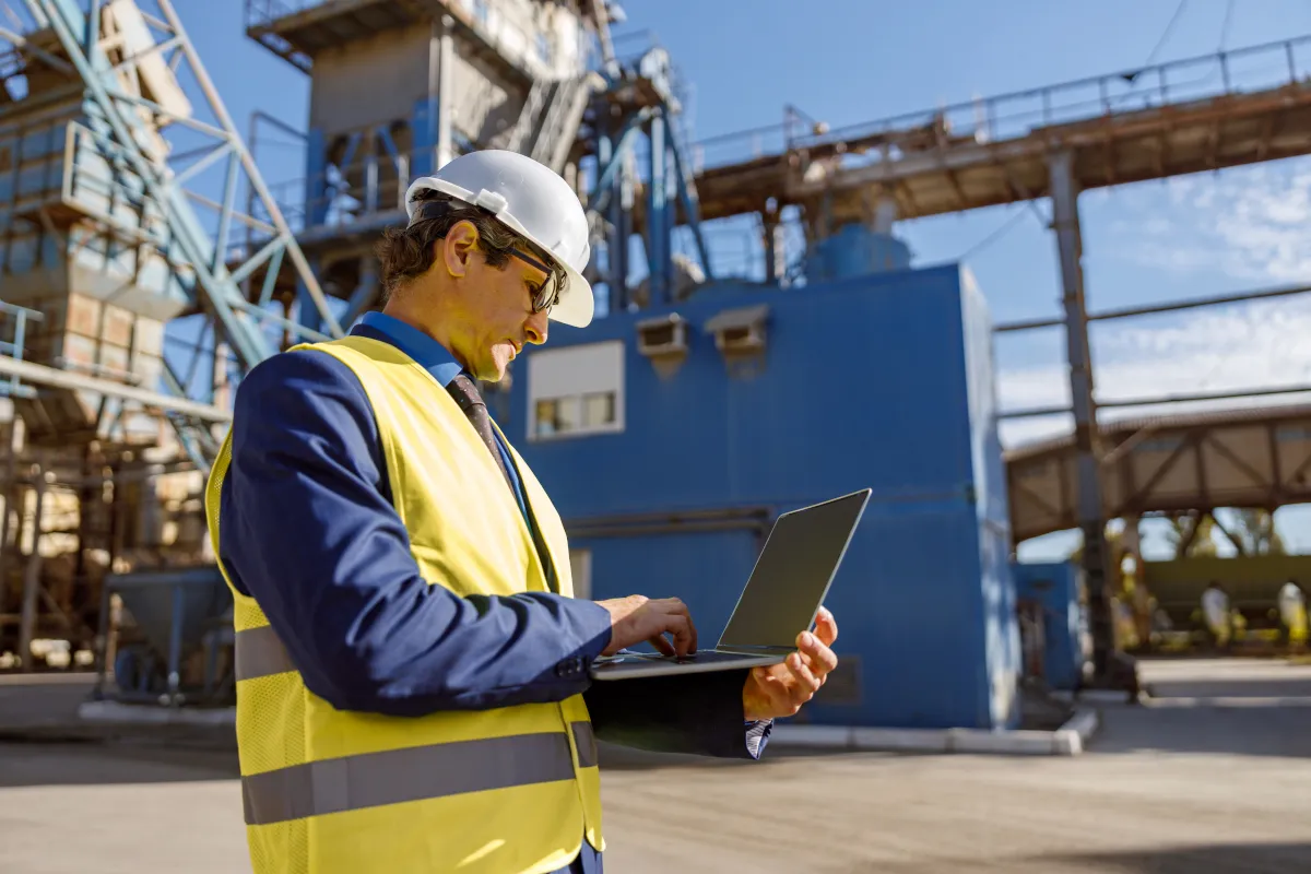 Alberta Oil & Gas Recruitment Agency that operators trust Hire Engine, an engineer looking at his computer in the field